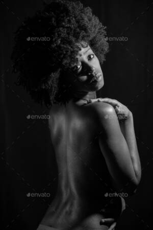 african american ghetto girl nudes - Black and white photograph of naked black woman under neon light Stock  Photo by javi_indy