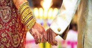 indian couple holding hands - How long do couples in arranged marriages wait before having sex