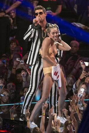 Miley Cyrus Nude Fucking - Why is Miley Cyrus simulating oral sex on 'Bill Clinton'?