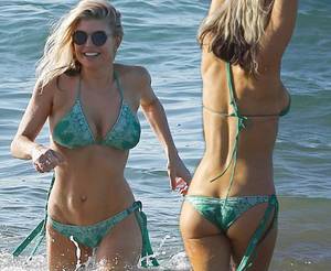 Fergie Flashing Tits - Singer Fergie shows off her washboard abs