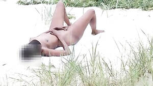 ebony beach masturbating - Ebony girl masturbates in the sand while being filmed | voyeurstyle.com