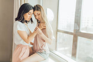 Naked Women Lesbians - two lesbians making love indoors. close up photo. copy space. sexual  behavior concept. females going to have sex. woman holding a shoulder of  other one Stock Photo | Adobe Stock