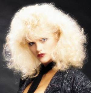 Big Hair 80s Porn - I am guessing it is an 80's porn start, but I am not sure.