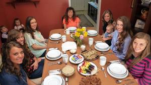family dinner - Michelle Duggar sits at the dinner table with other women and girls in the  family.