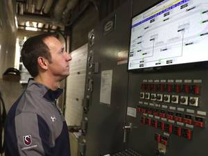 Bonnie Diver Porn - Facility Director Paul Golomski checks a console which