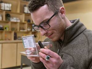 Blue Orchid 2000 Boy Porn - Customer Ben Crowley smells a sample of marijuana at