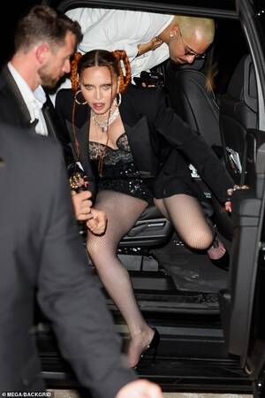 madonna upskirt - Madonna, 64, dons lingerie and wields riding crop at Sex book exhibition  during Miami Art Basel | Daily Mail Online