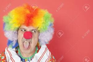Clown Porn Nude Male Good Looking - Senior Male Clown Sticking Out Tongue While Looking Away Over Red  Background Stock Photo, Picture and Royalty Free Image. Image 20766794.