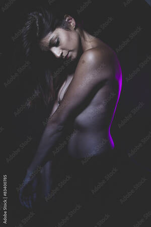 dark latin models nude - Performing, latina naked ballerina in a black tutu and pink ligh Stock  Photo | Adobe Stock