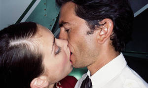 Cabin Sex Porn - Couple kissing on a plane