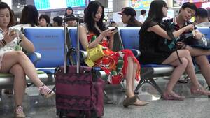asian shoe dangle - Asian beauty in summer dress caught on the airport dangling her shoe - Feet9