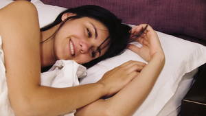 black sleeping girls naked - Woman thinking about love lying in bed smiling - HD stock footage clip