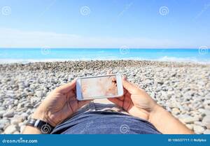 beach hairy naked - Tourist at the Beach Watching on His Phone Stock Image - Image of blue,  screen: 106537711