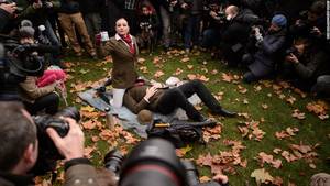 face sitting - Demonstrators take part in a mass "face-sitting protest" outside  the Houses