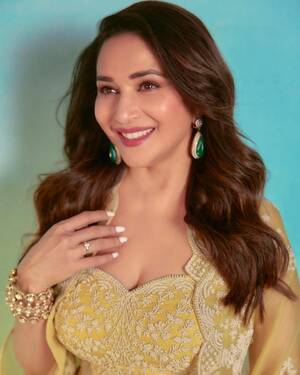 Madhuri Dixit Porn - Madhuri Dixit Nene's cape + drape skirt set proves why yellow is a wedding  wardrobe must-have | Vogue India | Wedding Wardrobe