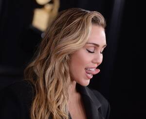 Miley Cyrus Porn Cum - Miley Cyrus Posts Naked Photo To Announce Woodstock 50 Performance