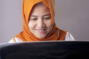 naughty - Woman with Naughty Expression Looking at Laptop Stock Photo - Image of  browsing, evening: 147828364