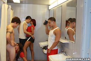 college room - Two playful young girls get naked in front of guys with camera in the dorm