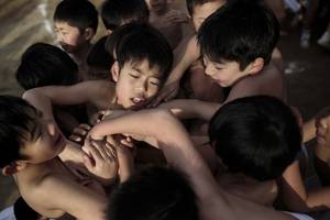 japan nude crowd - In this picture taken on February 18, 2017, Japanese boys fight to catch  sacred