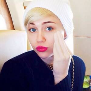 Miley Cyrus Strapon Porn - Miley Cyrus rubs face and crotch with hand sex toy and shares pics - Mirror  Online