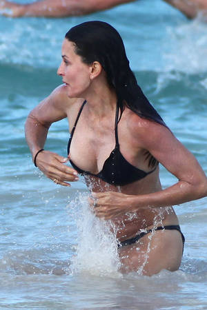 candid beach nip slip - Courtney Cox Nipple Slip In St. Barts While Frolicking In The Caribbean  Waves