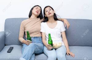 hot asian lesbians drunk - Drunk Lesbian Couple Young Asian Woman Sitting On The Sofa In Livingroom.  Emotions Concept Stock Photo, Picture and Royalty Free Image. Image  123523894.