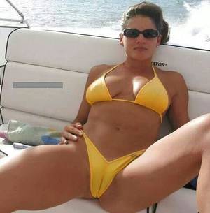 bikini cameltoe - hot model in yellow bikini at yacht spreads her legs for a cameltoe pic