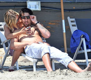 couples naked beach fun - BEACH BUMS: The couple catch some rays in Malibu [WENN]