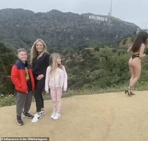 baja nudist sex - Awkward moment a family photo is ruined by nearly-nude woman posing next to  them | Daily Mail Online