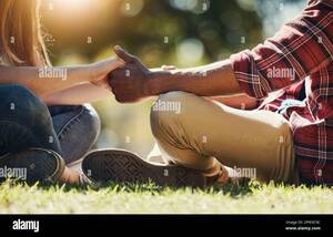 interracial couples holding hands - Interracial hand holding couple hi-res stock photography and images - Alamy