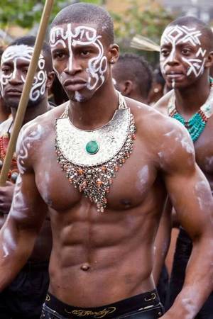 African Tribal Men Porn - I think this man is displaying beauty is because it is showing markings on  his face probably symbolizing a tribe that he belongs to.