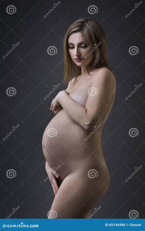 beautiful naked pregnant ladies - Beautiful Naked Pregnant Woman with Navel Piercing on Gray Studio  Background, Pregnancy Nude Concept Stock Photo - Image of beautiful, gray:  85146986