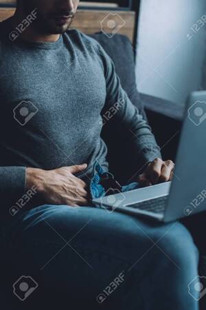 Masturbation Watching Computer Pornography - Cropped View Of Young Man Masturbating And Watching Pornography On Laptop  On Couch Stock Photo, Picture and Royalty Free Image. Image 141985006.