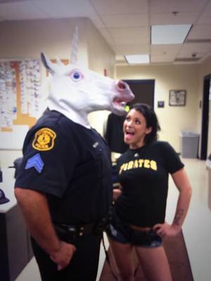 fun porn stars - A police officer is in trouble for taking a picture with a porn star while  wearing a unicorn mask. You read that right.