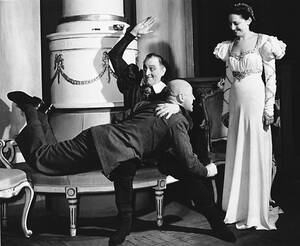 1940 British Porn - Actress Elaine Barrie observes as actor John Barrymore, Sr., demonstrates  the spanking scene