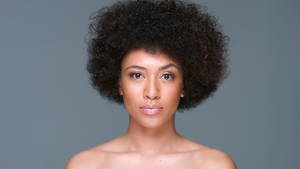 afro girl nude - Happy attractive smiling young African American woman with a large frizzy  afro hairdo and naked shoulders