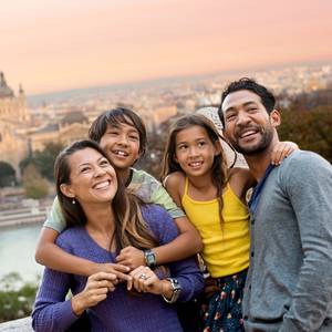 Family Fun Happy Days Porn - A family of 4 above a city look around with a sense of excitement ...