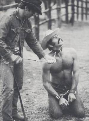 Cowboy Bondage Porn - gay cowboy in bondage cuffs wearing a collar and a leash