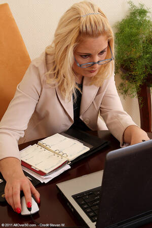 mature office secretary - Mature Platinum Blonde Secretary Wearing Black Dress in Office - Image  Gallery #108102
