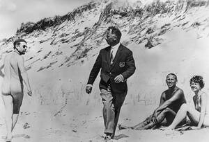 black nude beach couples - Shocked By Nudity. A naked couple look on in amusement as a fully-clothed  man turns to stare in disgust at a passing naturist on the beach. 1959  [980x669] : r/HistoryPorn