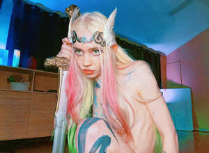 Grimes Porn - Grimes finally reveals her Halloween costume in spicy photos