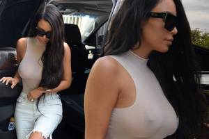 black tape on nipples - Kim Kardashian goes braless in a sheer nude bodysuit and cut-off shorts in  Miami