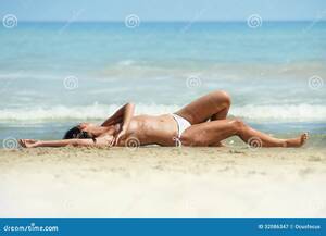 best tanned beach babes topless - Topless woman at the beach stock image. Image of rear - 32086347