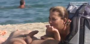 boner nude beach shots - Amateur wife is touching husbands boner on nude beach VIDEO Public Flashing