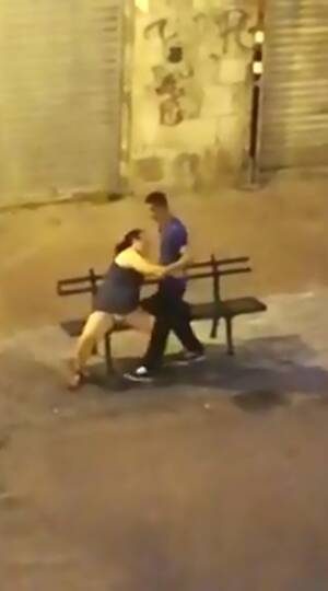 Drunk Public Sex Porn - Randy drunk Italian woman tries to lure her timid boyfriend into public sex  on a high street bench in shocking video | The Sun