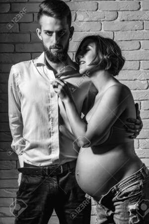 hot pregnant couple nude - Family Parent Couple Of Pretty Smiling Sexy Woman Or Cute Pregnant Girl  With Naked Round Belly Or Abdomen And Handsome Bearded Man Hipster In White  Shirt On Brick Wall Background At Mothers