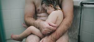 american nudist - What does this father-son image say about our attitude towards nudity?