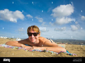 maspalomas nude beach xxx - Woman smiling on the beach at the nudist beach at Maspalomas on Gran  Canaria Stock Photo - Alamy