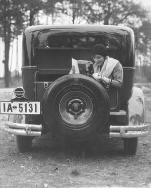 1920s Vintage Car Porn - Woman reading in car trunk,1920s Martin Badekow