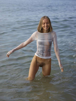 hot lesbians wet clothes - Young angel in very sexy transparent wet dress on the beach. 15 photos